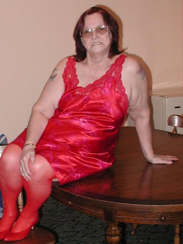 16P Nasty big granny in red stockings toying her hairy mature cunt