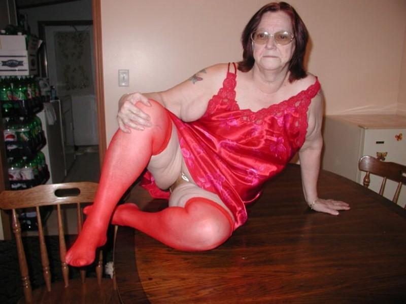 16P Nasty big granny in red stockings toying her hairy mature cunt
