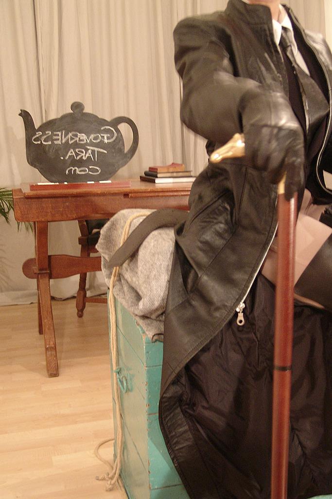 15P Strict domina in jodphurs and leather coat and riding boots