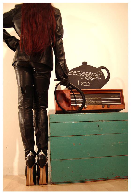 15P A strict gestapo mistress in leather and ultra high heels