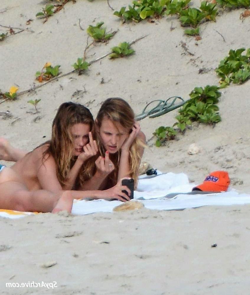 15P Two stunning blondes get naked at the beach