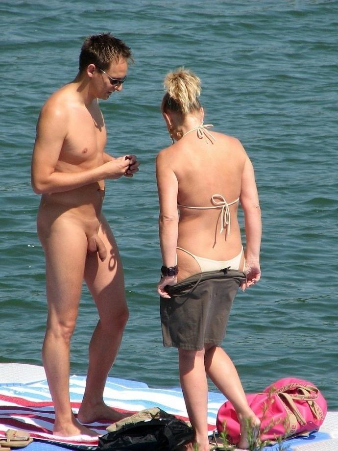 14P Two nudist friends get an even tan at the beach
