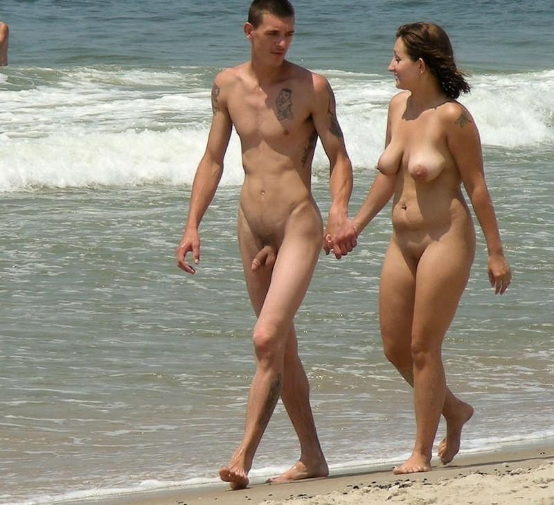15P Long haired brunette shows her goods at the beach
