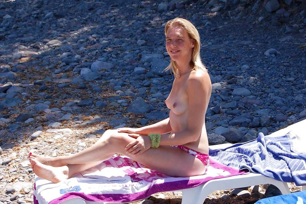 15P Brunette has some fun being nude on a public beach