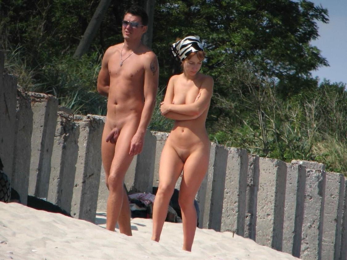 15P Sultry blonde babe strips and tans on a nude beach