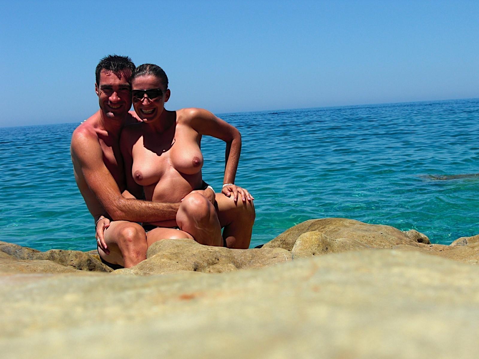 15P Nude friends play around at a public beach