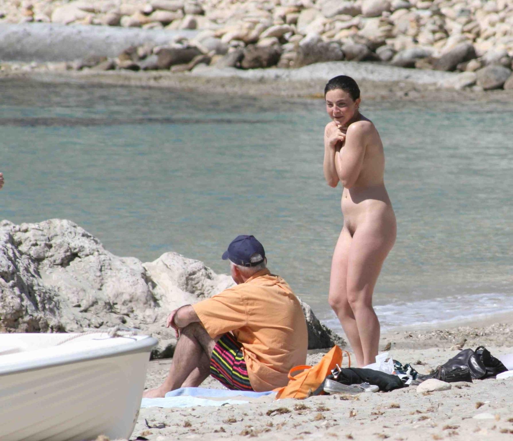 15P Horny hot babe with big tits strips on the beach