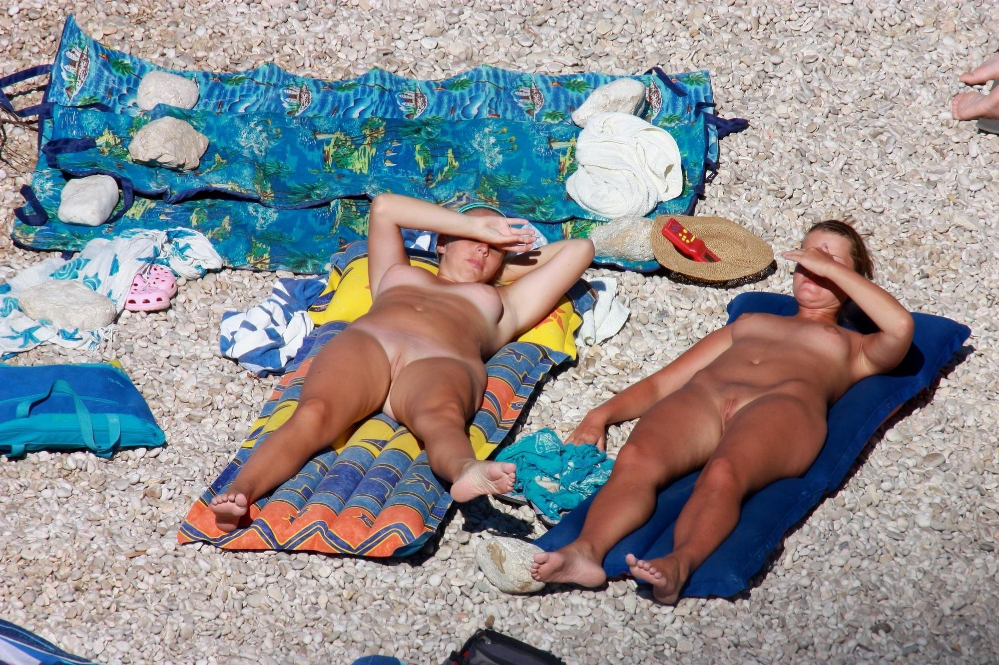 15P Milf loves to expose her body at the nude beach