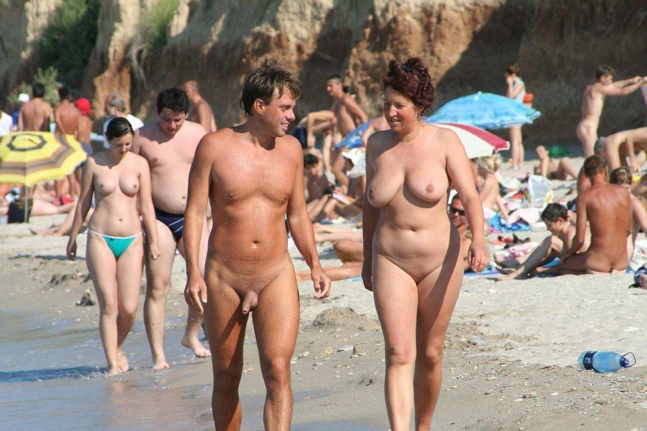 15P Beach nudists caught sunbathing nude in the rocks