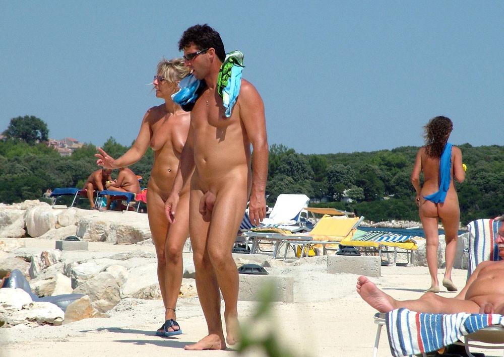 15P Two nudist friends get an even tan at the beach