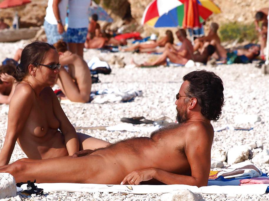 15P Brunette loves to expose her body at the nude beach