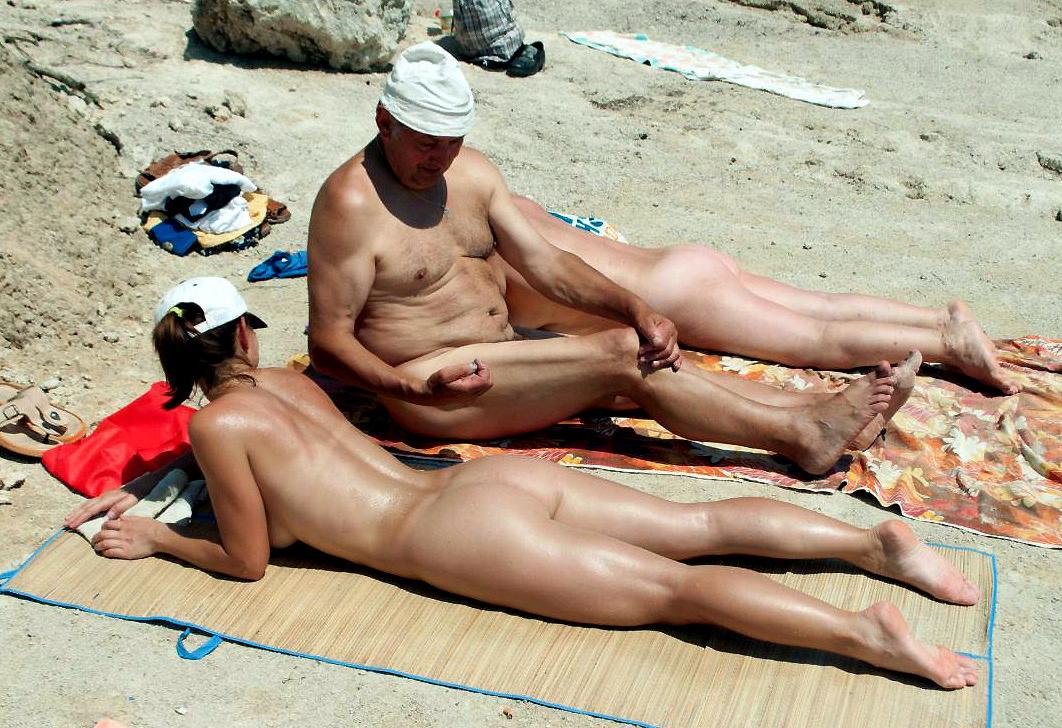 15P Sexy girl with big boobs naked at a nudist beach