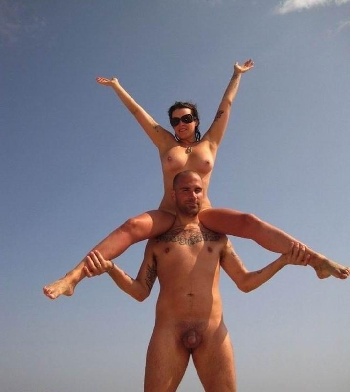 15P Sexy curvaceous girl strips at a nudist beach