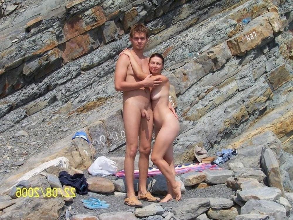 15P Perky breasted nude goddess poses on a public beach