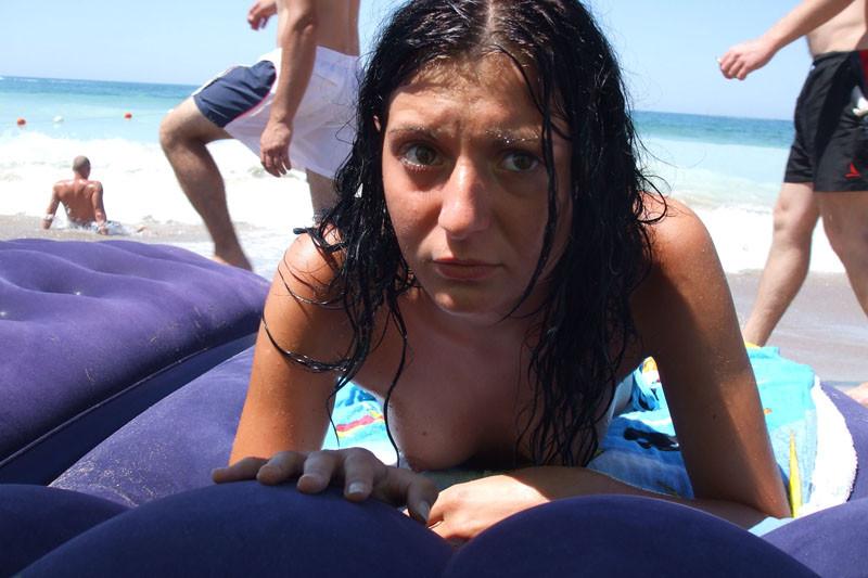 15P Brunette has some fun being nude on a public beach