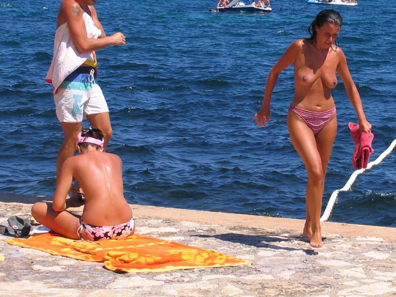 15P Brunette has some fun being nude on a public beach
