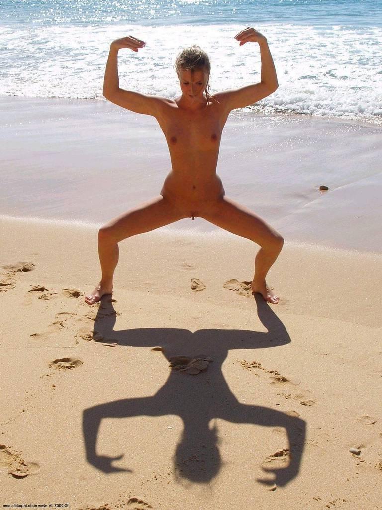 15P Brunette has some fun being nude on a public beach