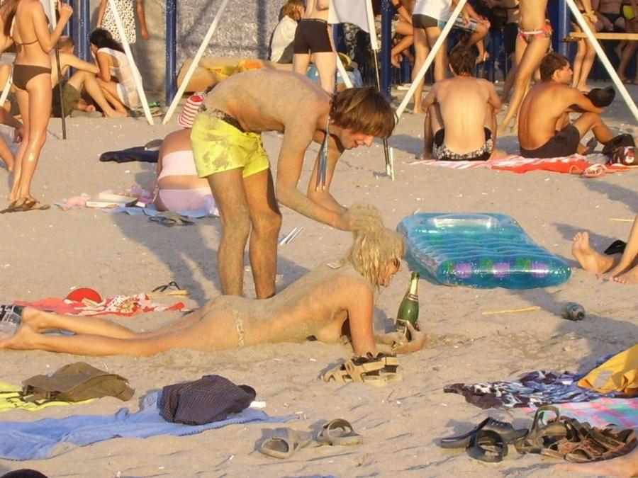 15P Young nudist friends naked together at the beach