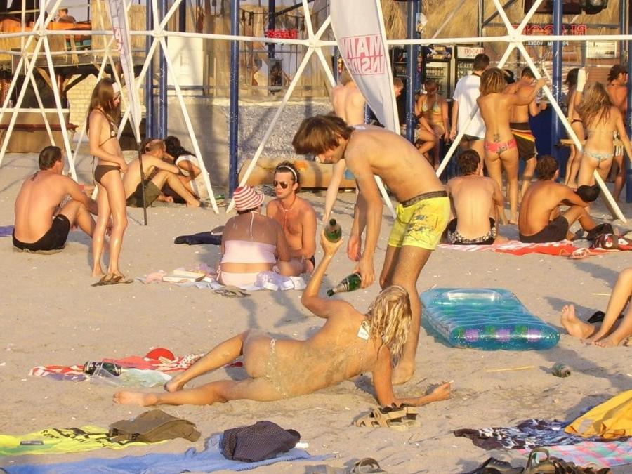 15P Young nudist friends naked together at the beach