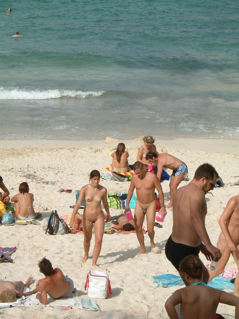 15P A public beach heats up with two hot teen nudists