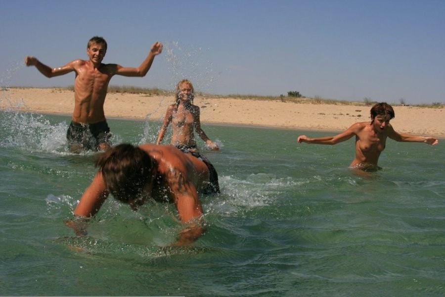 15P A public beach heats up with two hot teen nudists