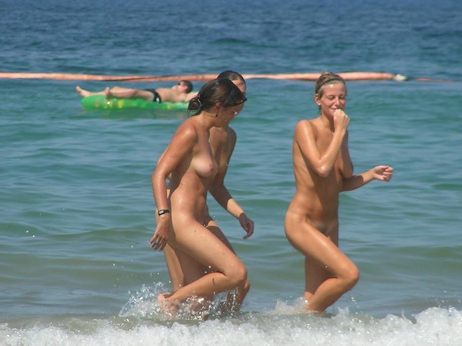 15P At the nudist beach teen girls play around naked