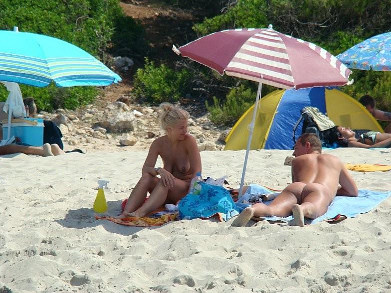 15P At the nudist beach teen girls play around naked