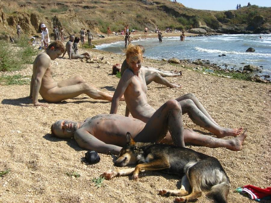 15P Friendly young Russian nudists lay on the beach