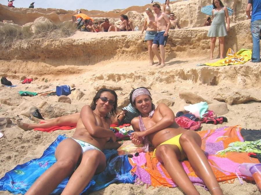 15P Friendly young Russian nudists lay on the beach