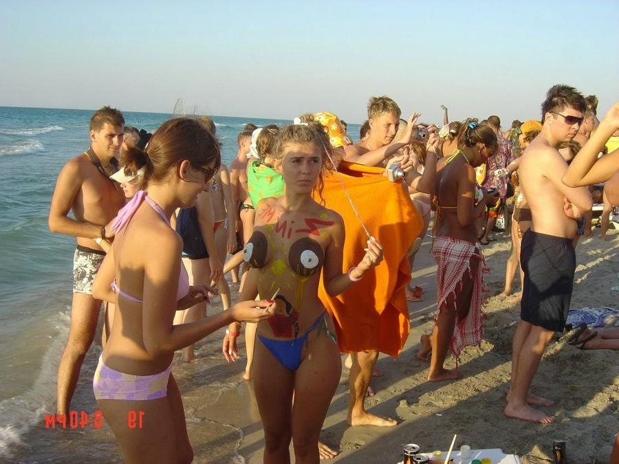15P Friendly young Russian nudists lay on the beach