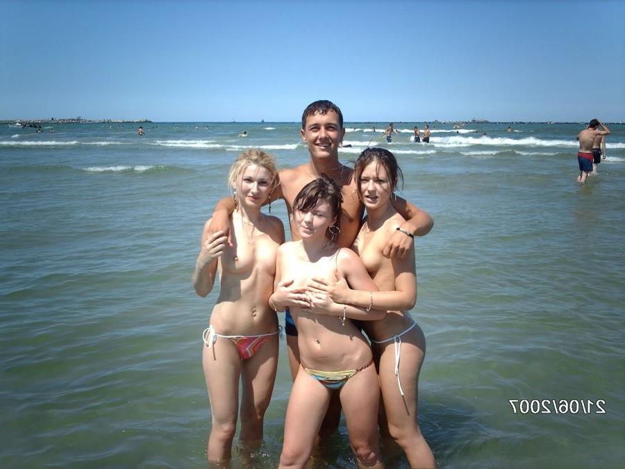 15P Friendly young Russian nudists lay on the beach