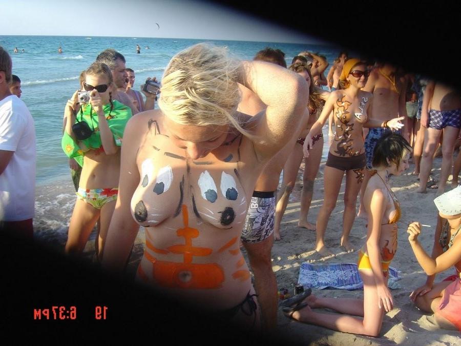 15P Friendly young Russian nudists lay on the beach