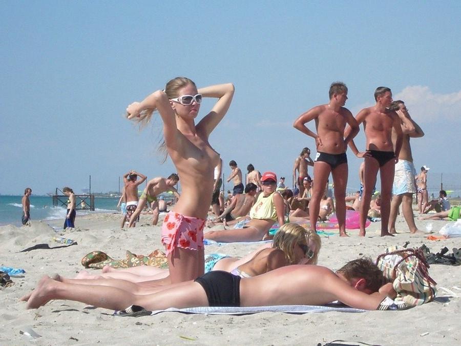 15P Friendly young Russian nudists lay on the beach