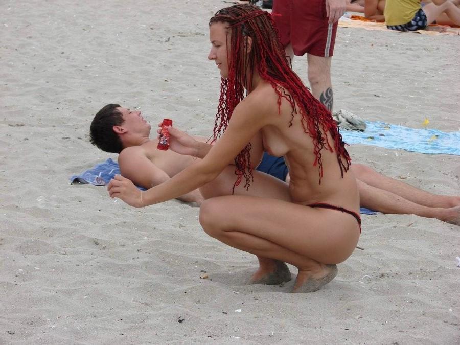 15P Blonde milf has some fun being nude on a public beach