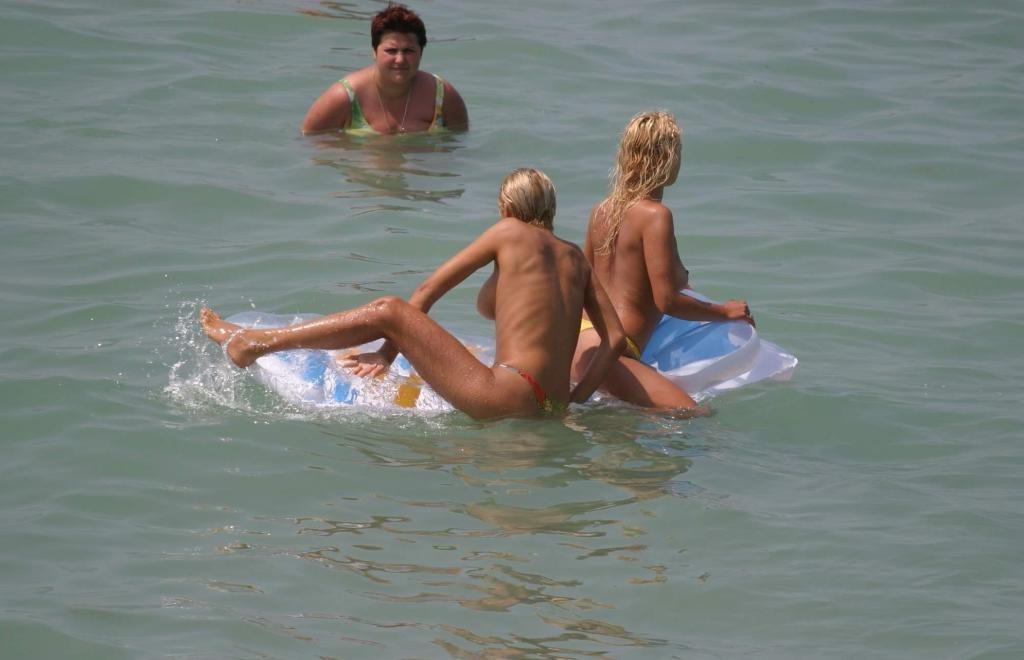15P Barely legal young nudist lays naked at the beach