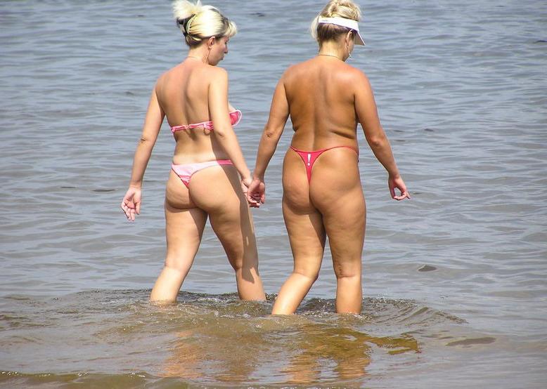 15P Busty babe shows her naked body at the nude beach