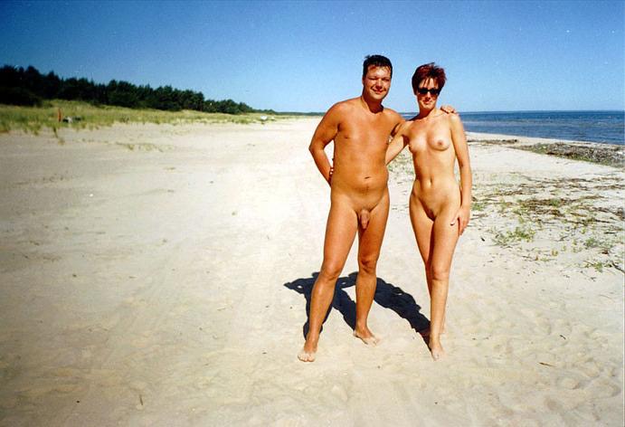 15P Busty babe shows her naked body at the nude beach