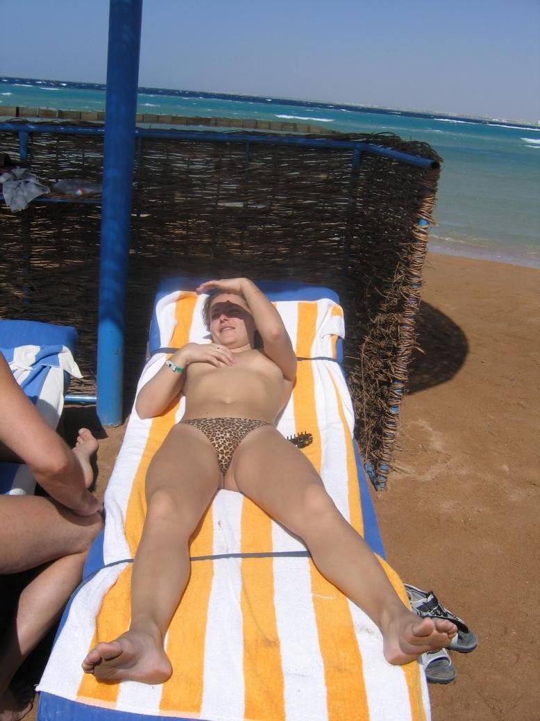 15P Barely legal young nudist lays naked at the beach