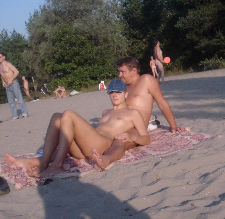 15P Barely legal young nudist lays naked at the beach