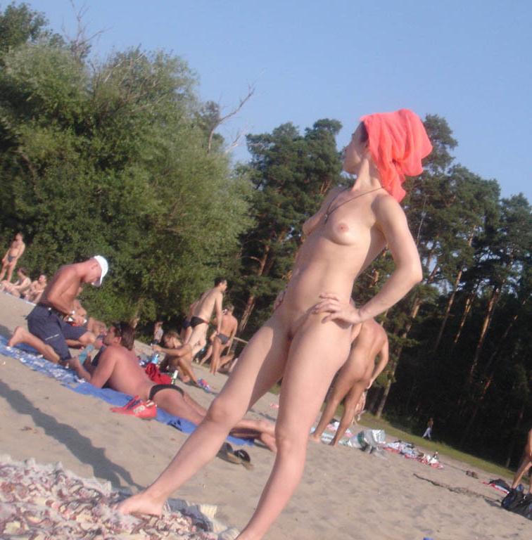 15P Barely legal young nudist lays naked at the beach