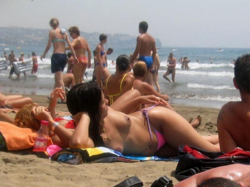 15P Barely legal nudist babe lights up at the beach