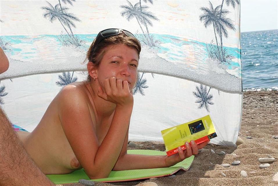 15P Busty chick shows her naked body at the nude beach