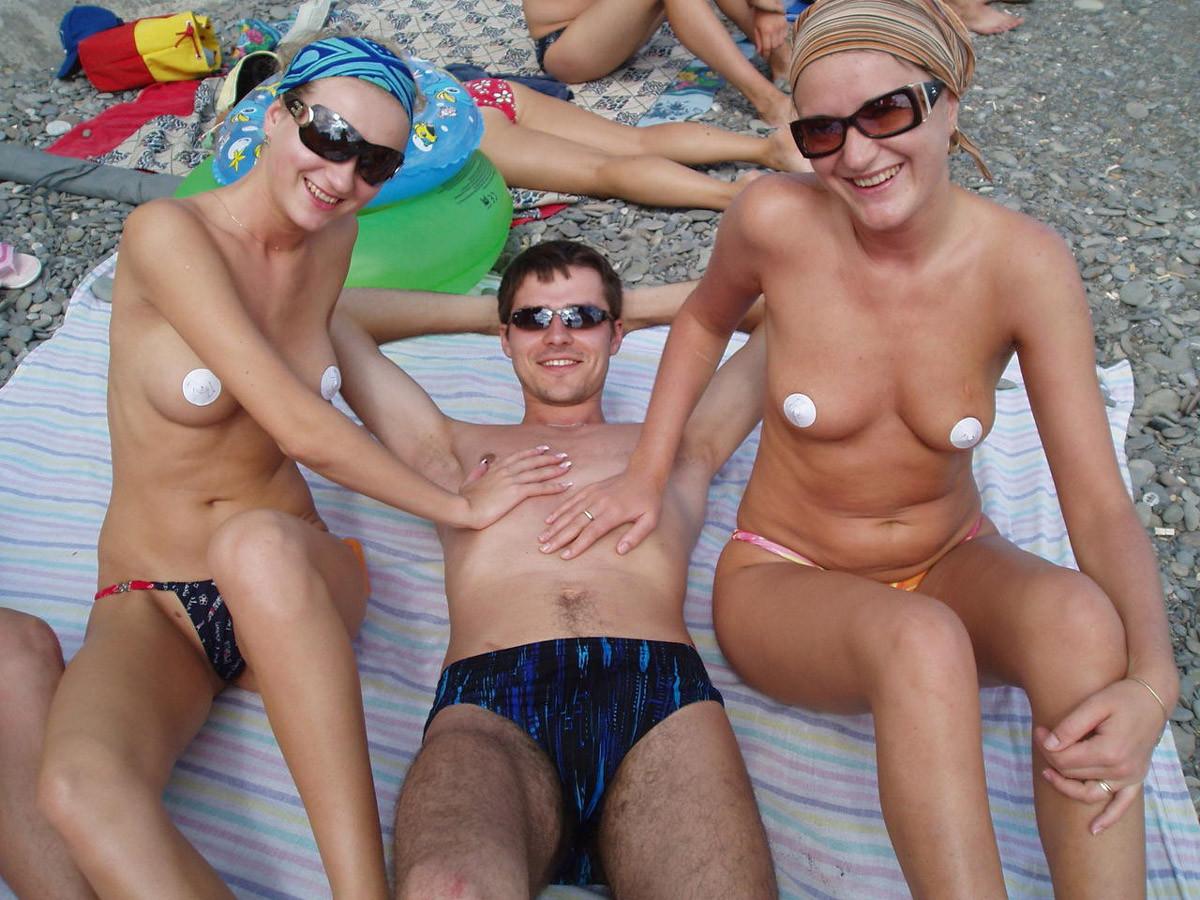 15P Friendly young Russian nudists lay on the beach