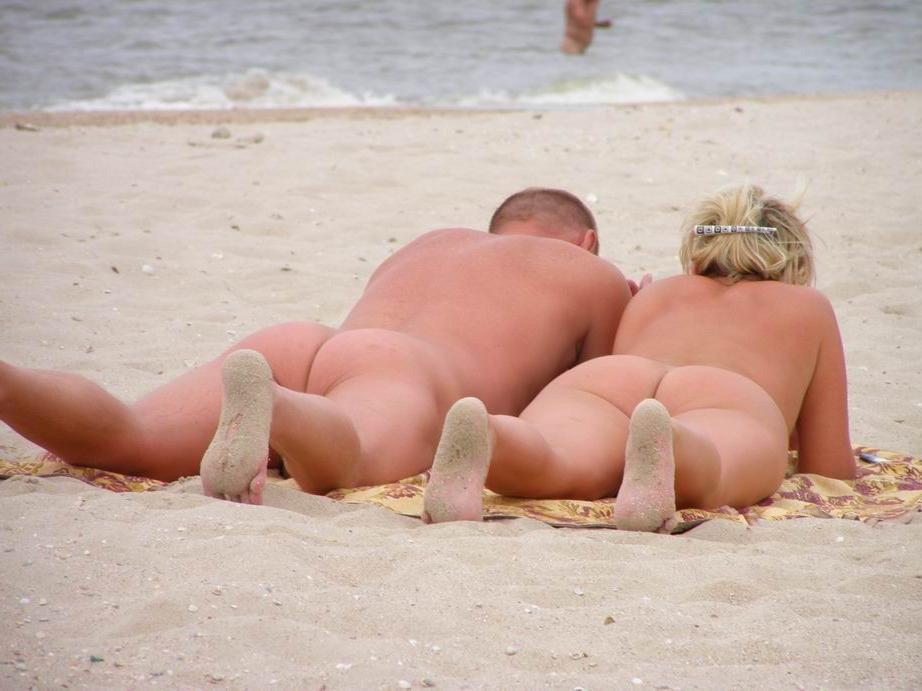 15P Perky breasted beach babe shows off her nude body