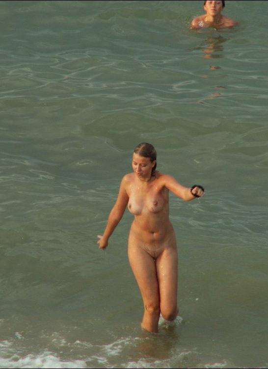 15P Friendly young Russian nudists lay on the beach