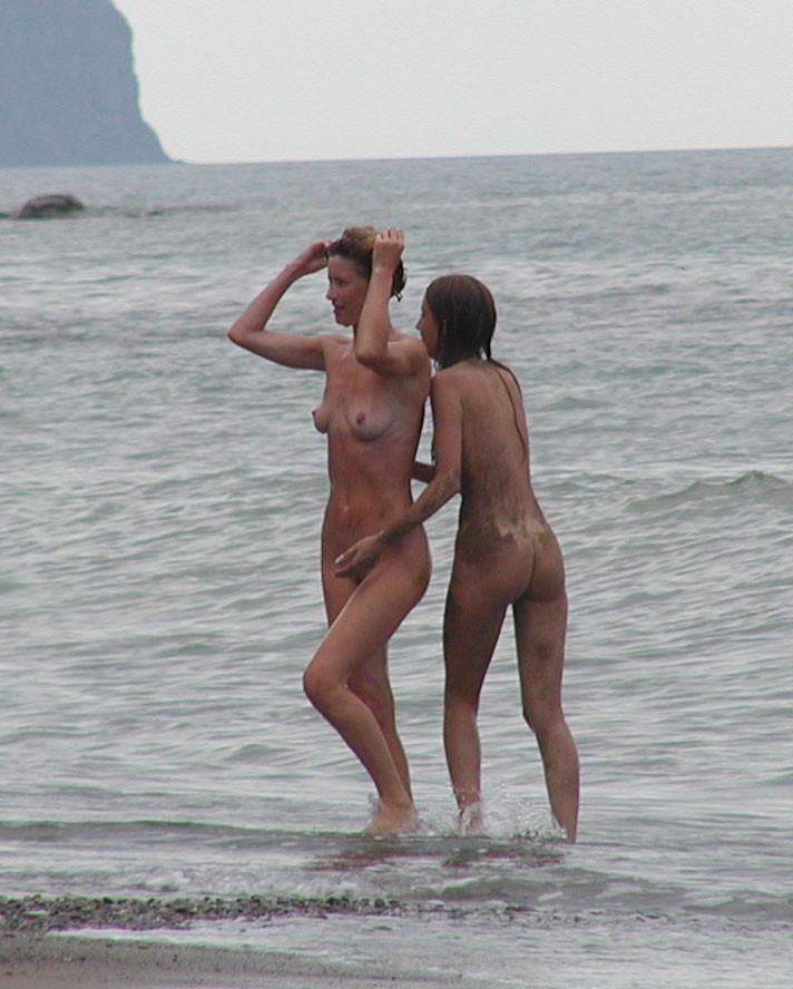 15P Friendly young Russian nudists lay on the beach