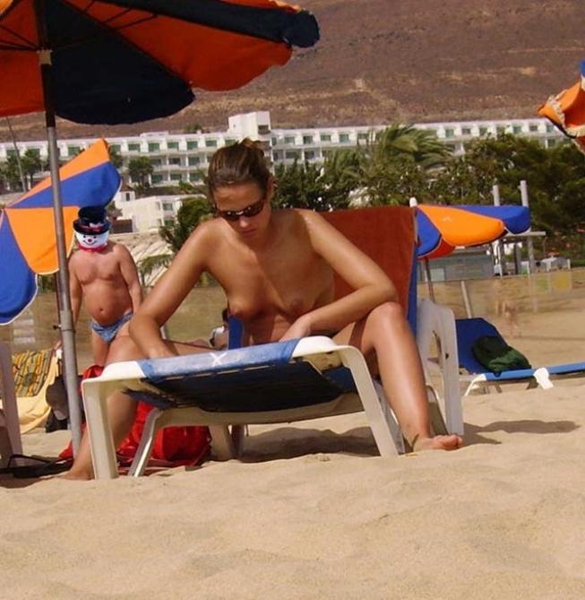 15P Friendly young Russian nudists lay on the beach
