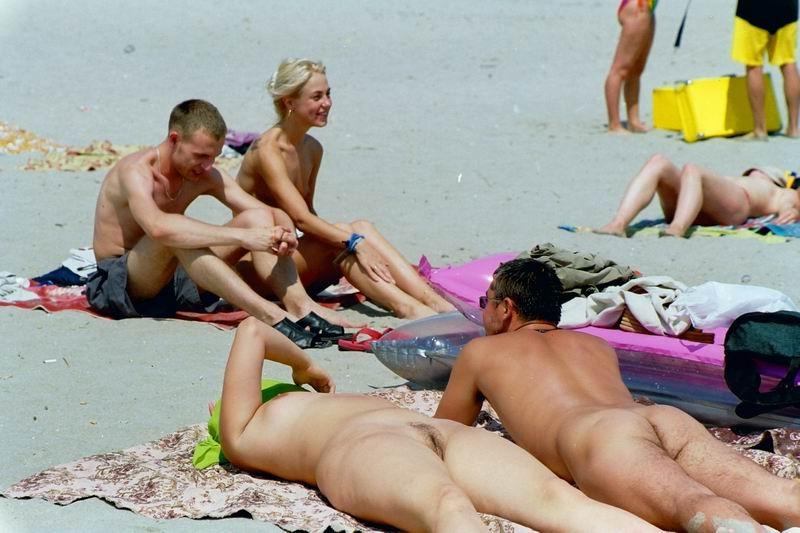 15P A public beach heats up with two hot teen nudists