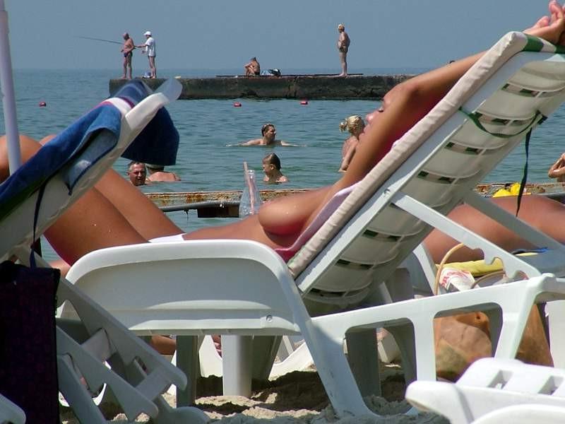 15P Nude teen friends play around at a public beach