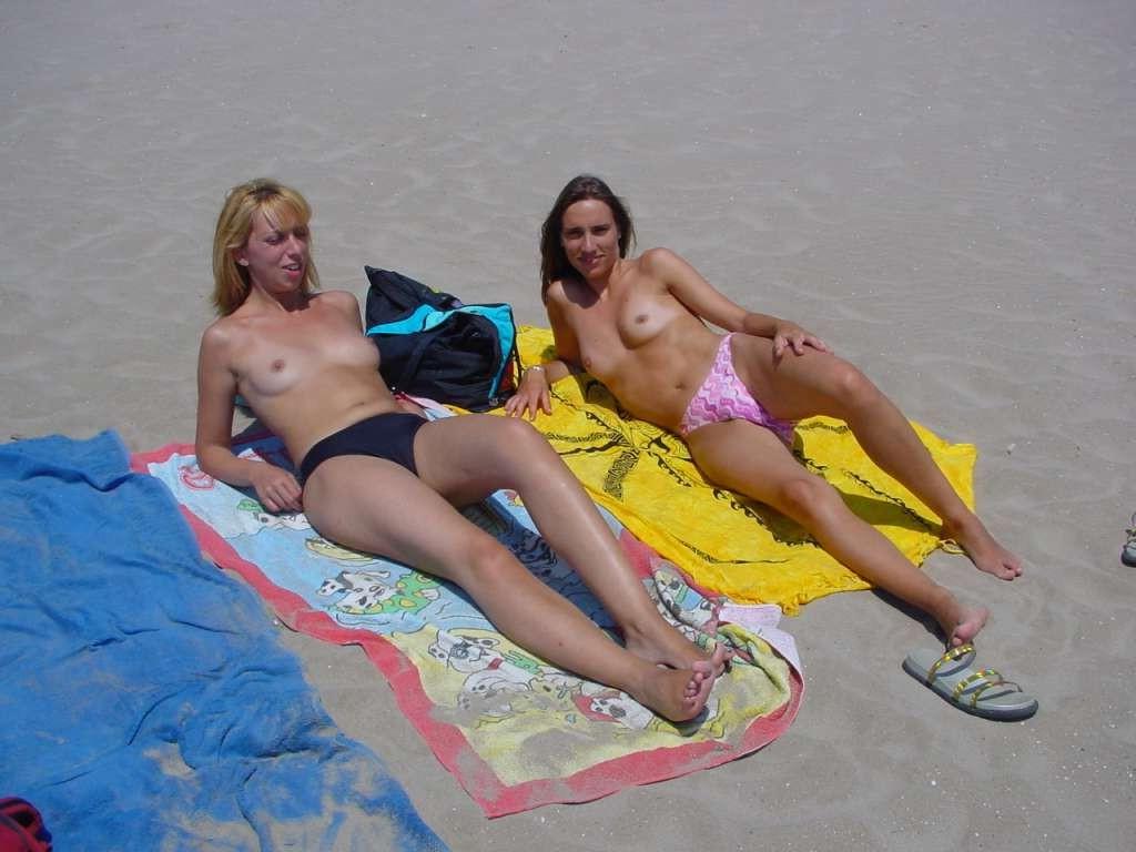 15P Slim teen with perky boobs naked at a nudist beach